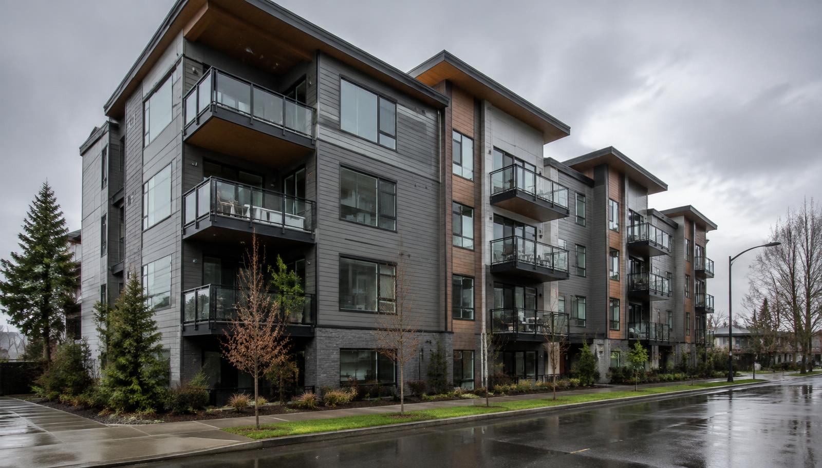 Modern multi-story condominium building in Vancouver, Washington on a rainy overcast day